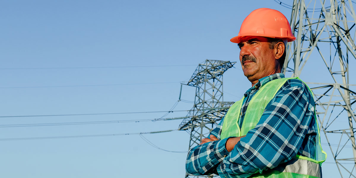 Man standing in front of utility lines